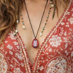 Bohemian necklace with a Zen figure made of wood and fused blue glass